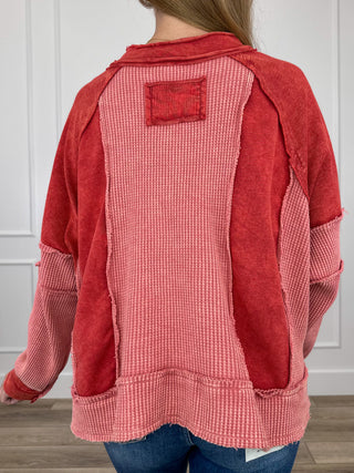 Brick red hooded long-sleeve cotton top with contrast back patch and kangaroo pocket