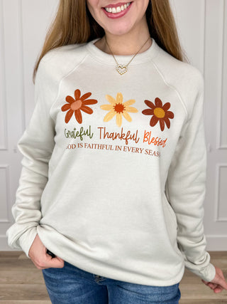 Oat crewneck sweatshirt with floral Faithful Thanks graphic and long sleeves