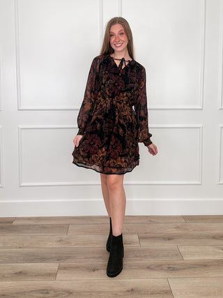 Avery Mae dress with long sleeves, dark floral print, short tiered hem