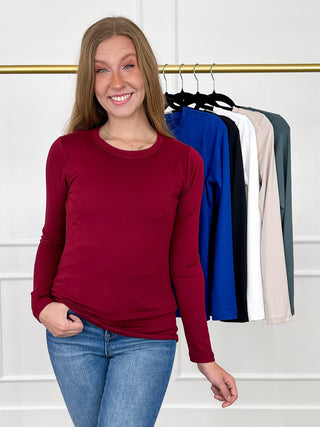 Wine red long-sleeve crewneck fitted top, casual front view