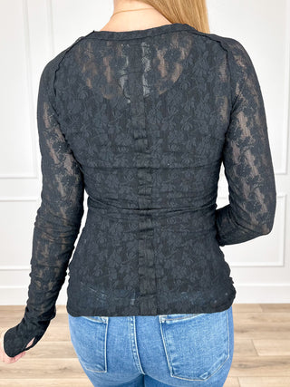 Black lace long-sleeve top back view with gathered waist and fitted shape