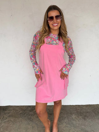 Pink cotton-blend overall dress with front bib, patch pockets and adjustable straps