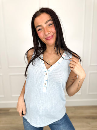 Light blue knit tank top with henley button placket, sleeveless