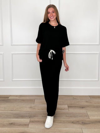 Black ribbed high-rise lounge set, front view with short-sleeve top and drawstring joggers