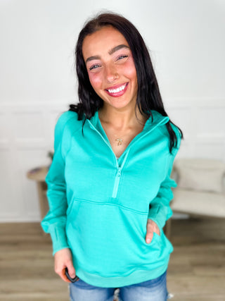Hooded quarter-zip long sleeve sweatshirt in teal with kangaroo pocket