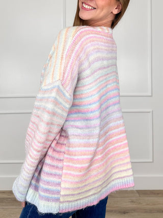 Pastel multi striped knit cardigan from back view, long sleeves and ribbed hem