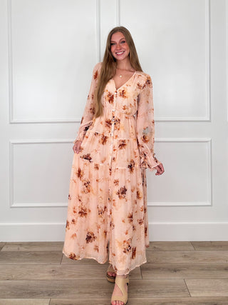 Peach floral button-up maxi dress with V-neck, long sleeves, gathered tiers