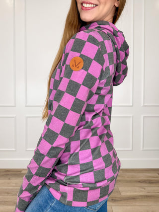 Purple checkered hoodie with front pocket, drawstring, and orange logo patch