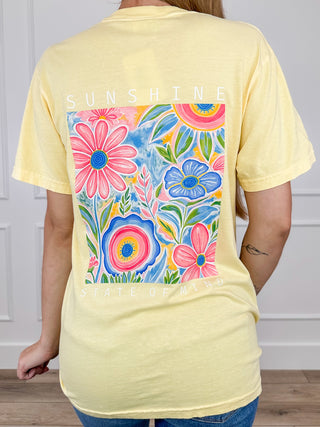 Yellow cotton short-sleeve tee with back 'SUNSHINE' and large colorful floral square