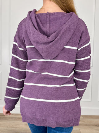 Purple hooded knit sweater with white stripes, back view