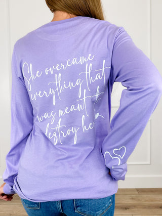 Purple long-sleeve graphic tee with large back text and heart accents.