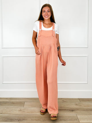 Ribbed coral orange overalls with adjustable straps and loose wide leg