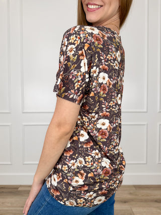 Brown floral short-sleeve top, curved hem, side view