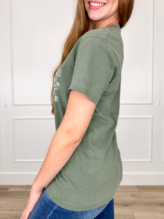 Even in the Chaos Cotton Short Sleeve Green Avery Mae Graphic Tee Shirt (Comfort Colors)