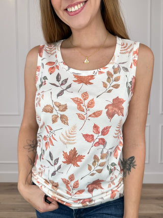 Ivory sleeveless scoop-neck tank top with rust and green leaf floral print