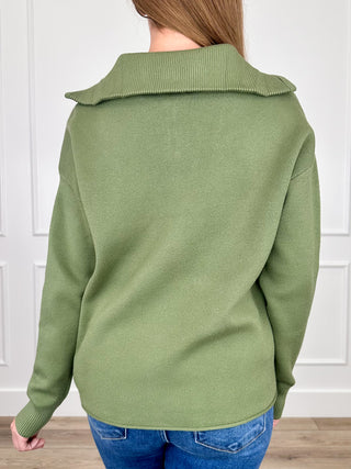 Green back view half-zip knit sweater with ribbed hem and cuffs