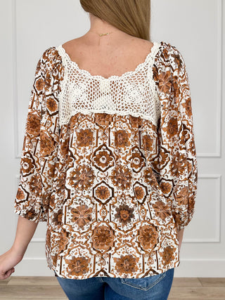Cream peasant top with brown floral print, crochet lace neckline detail, 3/4 sleeves