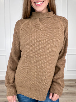 Brown knit long-sleeve sweater with high turtleneck and relaxed fit
