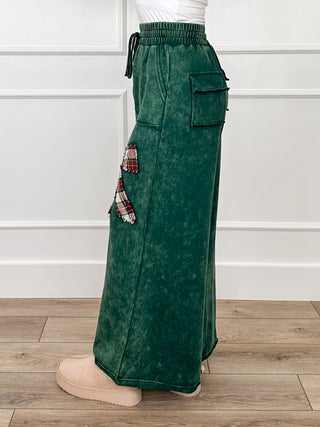 Green high-rise wide-leg pants with cargo pockets and hanging plaid side bow