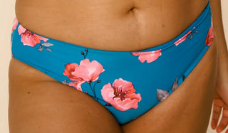 Reversible low-rise swim bottoms, turquoise with pink floral print