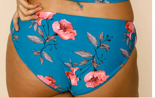 Reversible low-rise swim bottoms, turquoise with large pink flower pattern