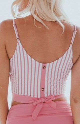 Pink striped backless swim top with spaghetti straps, button panel, and tied bow