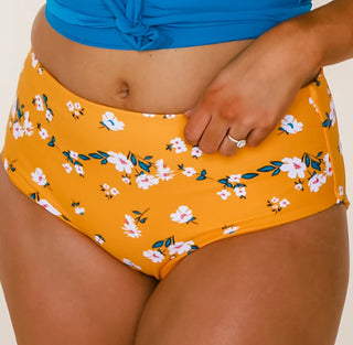 High-rise swim bottoms in orange with daisy floral print