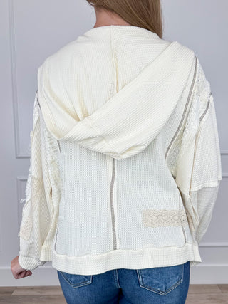 Cream hooded shacket with draped hood, back yoke detail, and long sleeves