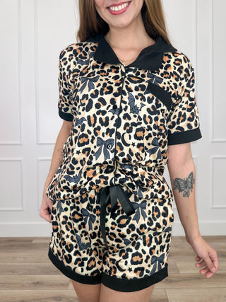 Leopard-print high-rise pajama set with button-up shirt, tie waist, and matching shorts