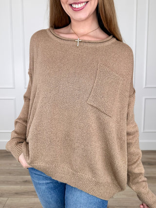 Tan knit long-sleeve sweater with ribbed crew neckline, relaxed fit