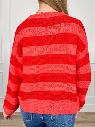 Red knit long-sleeve sweater top with wide horizontal stripes, back view
