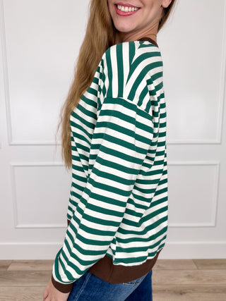 Green and white striped long-sleeve top, side view with dropped shoulder and ribbed hem