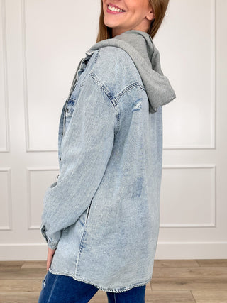 Acid-wash denim hoodie jacket, long sleeves, side view with hood and distressed details