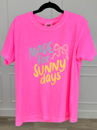 Pink short sleeve graphic cotton tee shirt on hanger, crew neck; "Made for sunny days"