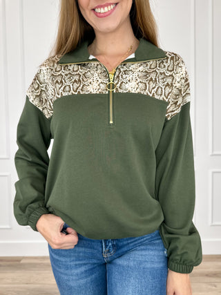 Long sleeve quarter-zip pullover top, green with snake print yoke and gold zipper
