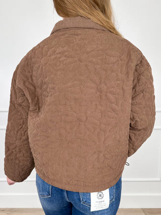 Brown quilted cropped jacket back view with quilted pattern and stand collar.