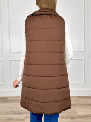 Dark brown sleeveless puffer vest with hood, back view and horizontal quilting