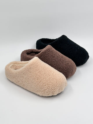Sherpa slip-on shoes in cream, brown, and black with padded open-top cuff