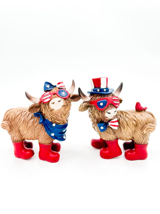 Set of two plush cow figurines with patriotic top hats and red boots