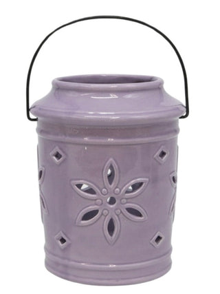 Purple ceramic lantern with handle and cutout flower pattern