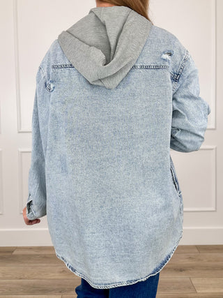Back view acid-wash denim hoodie jacket with full hood and distressed patch pockets