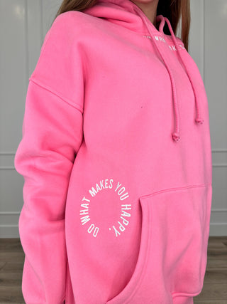 Pink hooded pullover sweatshirt with drawstring and front pocket, text graphic on chest