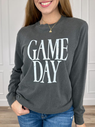 Grey long-sleeve graphic tee with white “GAME DAY” lettering on the front