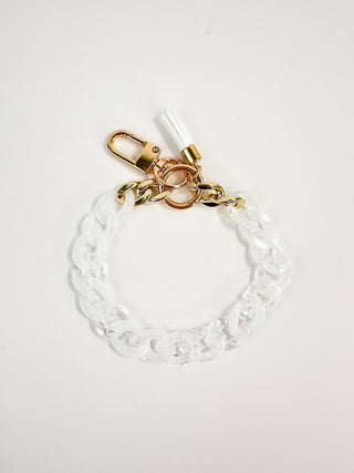 White beaded chain wristlet keychain with gold clasp and tassel charm