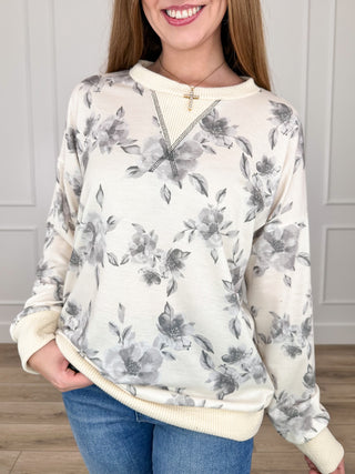 Floral knit long-sleeve top with crew neck, off-white base and grey flower pattern