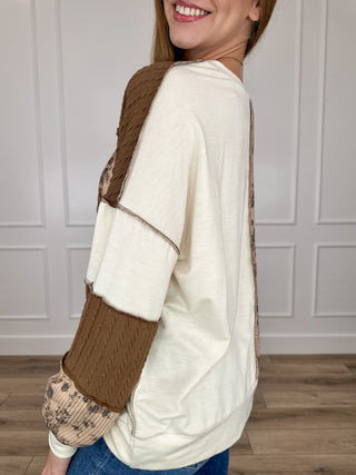 Cream and brown patchwork knit long-sleeve top with floral cuff panels