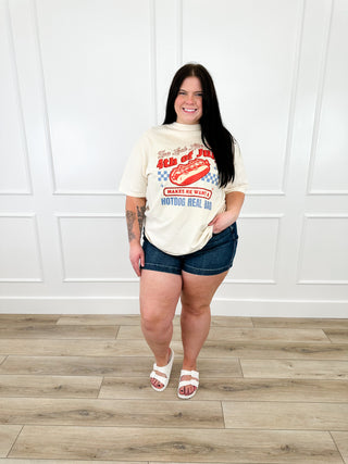 Cream short-sleeve T-shirt with hot dog graphic, worn with denim shorts