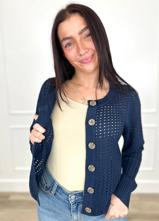 Navy knit long-sleeve button-up cardigan with round gold buttons, open front