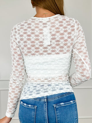 White sheer lace long-sleeve top with floral back design and crew neck