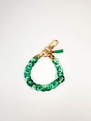 Green beaded chain wristlet keychain with gold clasp and tassel charm